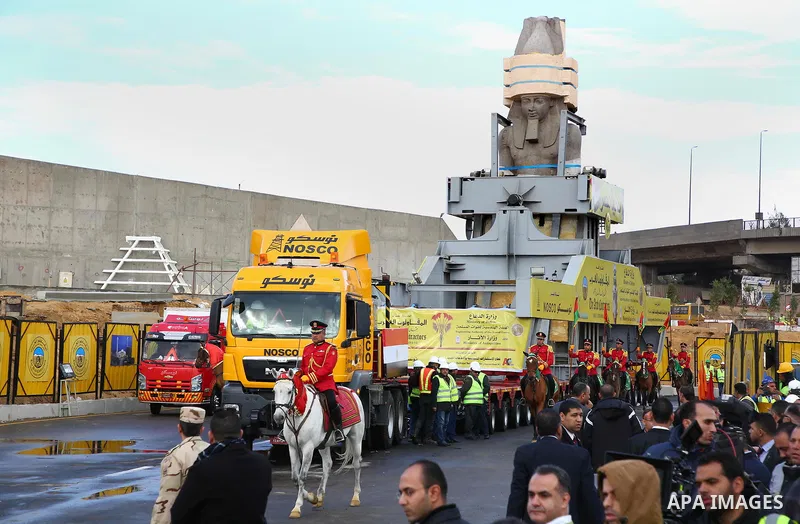 The 3,200-year-old colossal statue of King Ramses II is seen during its transfer to the main entrance of the Grand Egyptian Museum in Cairo's twin city Giza on January 25, 2018. Photo by Amr Sayed