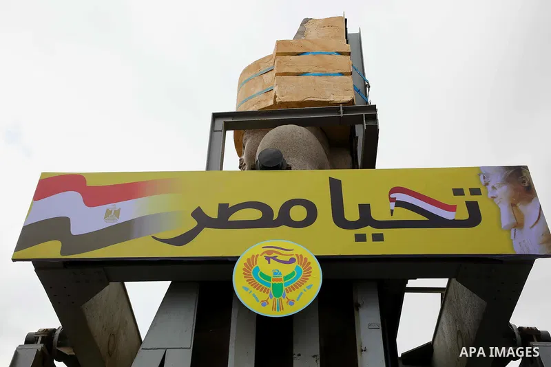 The 3,200-year-old colossal statue of King Ramses II is seen during its transfer to the main entrance of the Grand Egyptian Museum in Cairo's twin city Giza on January 25, 2018. Photo by Amr Sayed