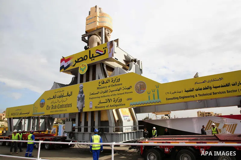 The 3,200-year-old colossal statue of King Ramses II is seen during its transfer to the main entrance of the Grand Egyptian Museum in Cairo's twin city Giza on January 25, 2018. Photo by Amr Sayed