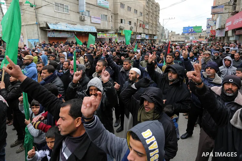 Palestinian supporters of Hamas movement take part during a protest against US President Donald Trump's decision to recognise Jerusalem as the capital of Israel, in Khan Younis in the southern Gaza Strip on January 26, 2...