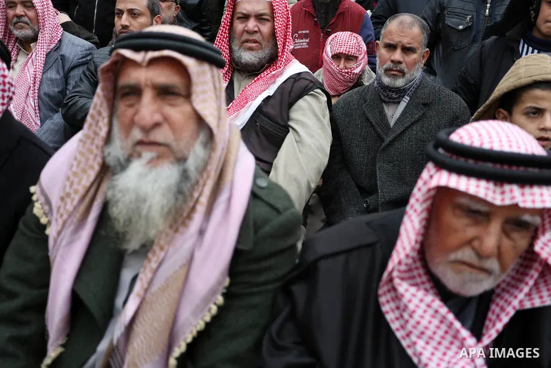 Palestinian supporters of Hamas movement take part during a protest against US President Donald Trump's decision to recognise Jerusalem as the capital of Israel, in Khan Younis in the southern Gaza Strip on January 26, 2...