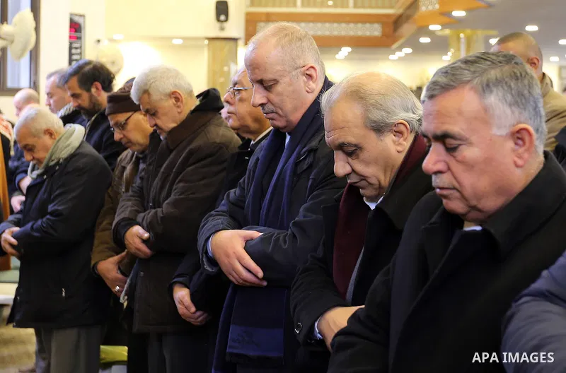 Palestinian Prime Minister Rami Hamdallah prays over the body of Ghassan Shakaa, a member of the Executive Committee of the PLO, in the mosque during his funeral in the West Bank city of Nablus on January 26, 2018. Photo...
