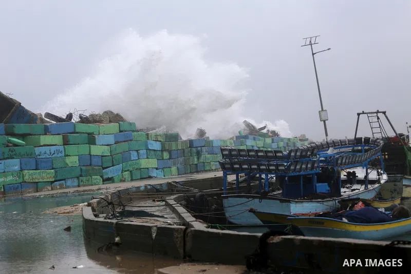Waves break on the sea port in Gaza City during a rainy storm on January 27, 2018. Photo by Mohammed Asad