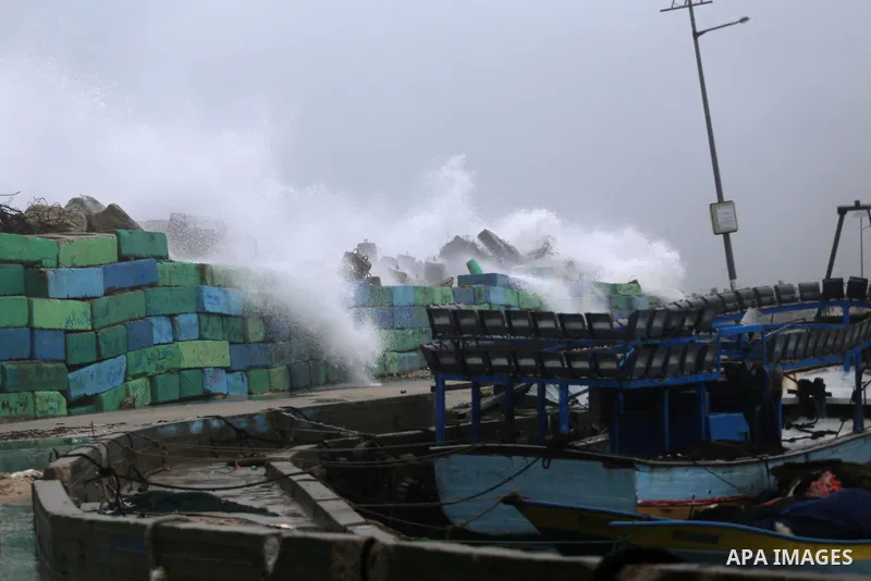 Waves break on the sea port in Gaza City during a rainy storm on January 27, 2018. Photo by Mohammed Asad