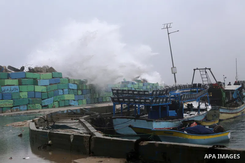 Waves break on the sea port in Gaza City during a rainy storm on January 27, 2018. Photo by Mohammed Asad