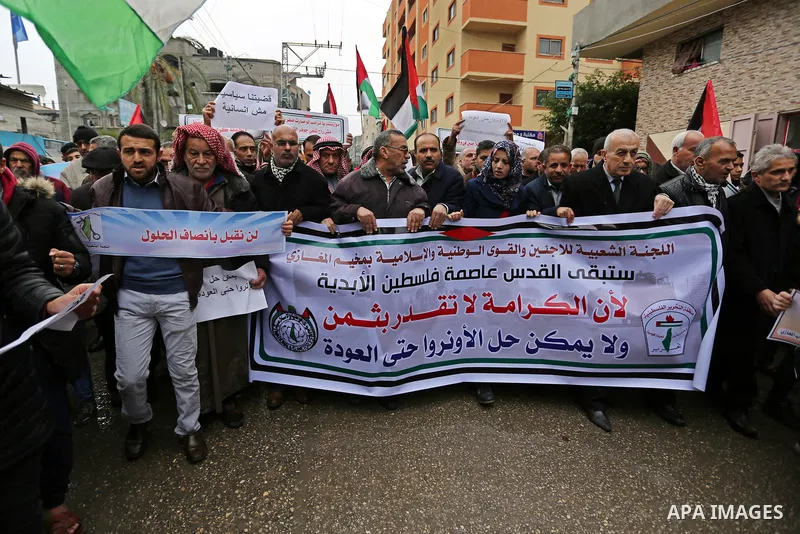 Palestinians take part during a protest against US President Donald Trump's decision to recognise Jerusalem as the capital of Israel and froze tens of millions of dollars in contributions to the United Nations Relief and...