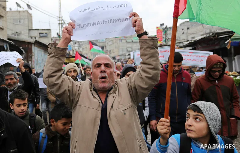 Palestinians take part during a protest against US President Donald Trump's decision to recognise Jerusalem as the capital of Israel and froze tens of millions of dollars in contributions to the United Nations Relief and...