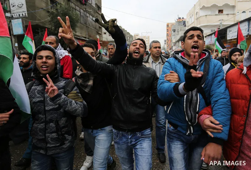 Palestinians take part during a protest against US President Donald Trump's decision to recognise Jerusalem as the capital of Israel and froze tens of millions of dollars in contributions to the United Nations Relief and...