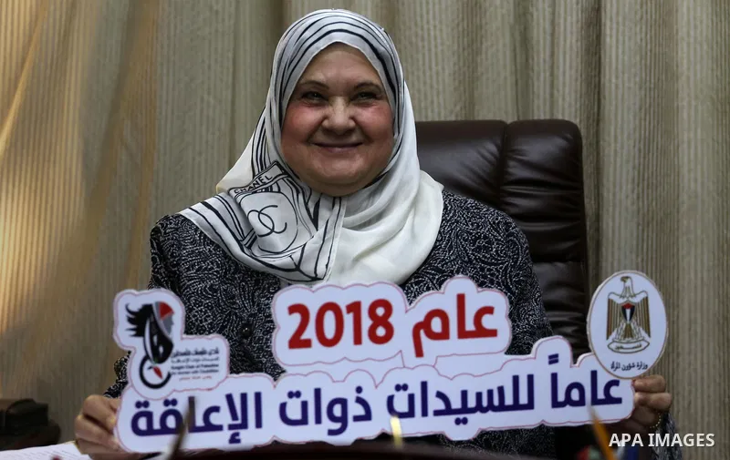 Palestinian minister of woman's Affairs, Haifa Al-Agha, meets with disabilities women at her office, in Gaza city on January 28, 2018. Photo by Mohammed Asad
