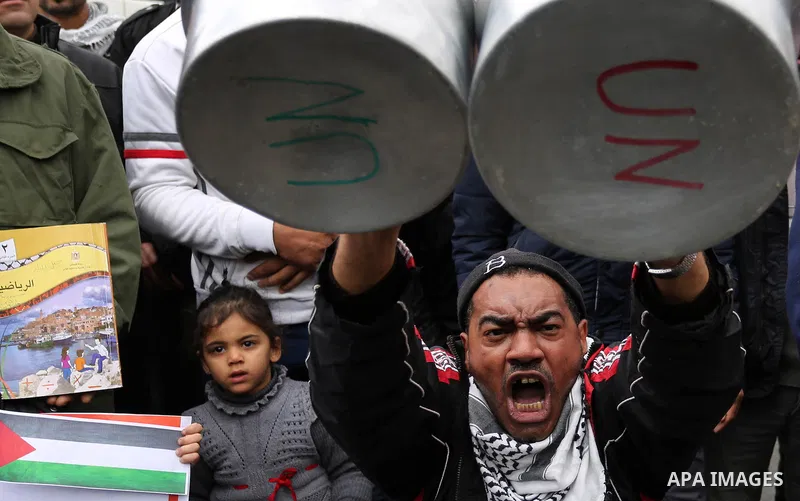 Palestinians take part in a protest against aid cuts, outside the United Nations' offices in Khan Yunis in the southern Gaza Strip on January 28, 2018. On January 16, Washington held back $65 million that had been earmar...