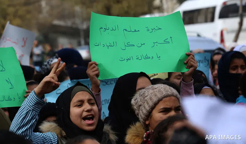 Palestinians take part in a protest against froze tens of millions of dollars in contributions to the United Nations Relief and Work Agency (UNRWA), in the West Bank city of Nablus, on January 28, 2018. Photo by Shadi Ja...
