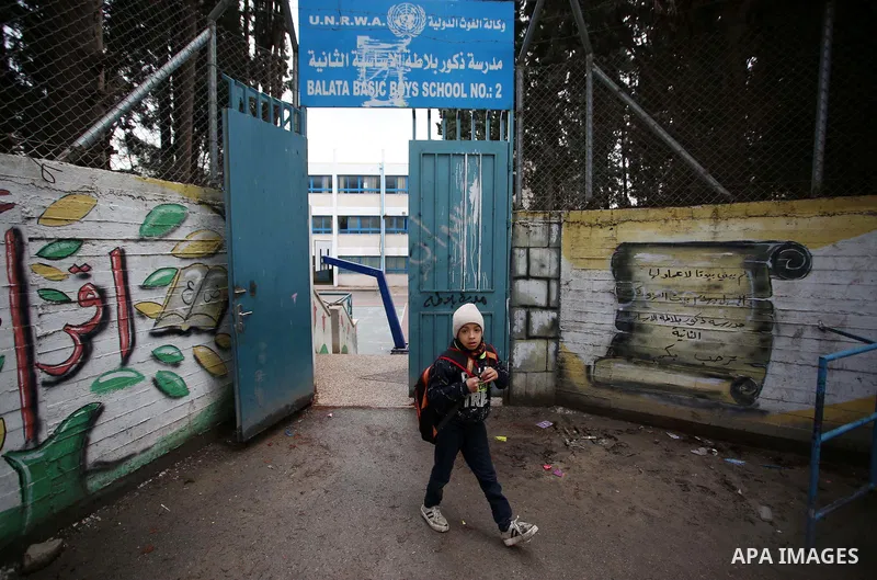 Palestinians take part in a protest against froze tens of millions of dollars in contributions to the United Nations Relief and Work Agency (UNRWA), in the West Bank city of Nablus, on January 28, 2018. Photo by Shadi Ja...