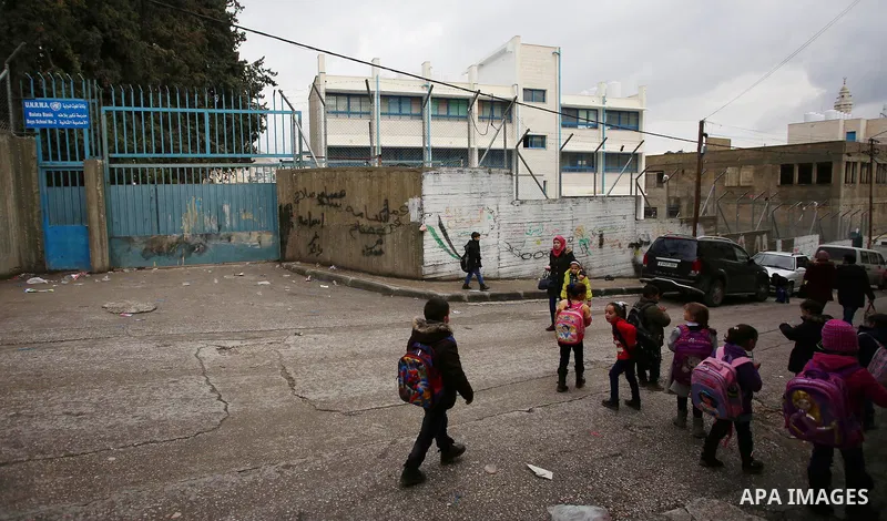 Palestinians take part in a protest against froze tens of millions of dollars in contributions to the United Nations Relief and Work Agency (UNRWA), in the West Bank city of Nablus, on January 28, 2018. Photo by Shadi Ja...