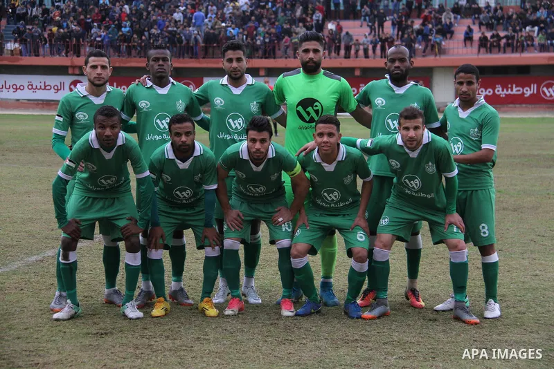 Palestinian players of Khadamat Rafah club pose for a photo before their football match with Khadamat al-Shati at Palestine Stadium in Gaza city on January 28, 2018. Photo by Mahmoud Ajour