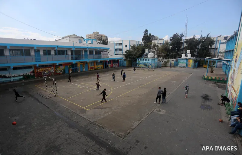 Palestinian boys play football inside a closed school during the strike against froze tens of millions of dollars in contributions to the United Nations Relief and Work Agency (UNRWA), in Gaza city on January 29, 2018. P...