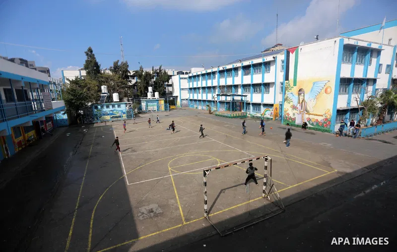 Palestinian boys play football inside a closed school during the strike against froze tens of millions of dollars in contributions to the United Nations Relief and Work Agency (UNRWA), in Gaza city on January 29, 2018. P...