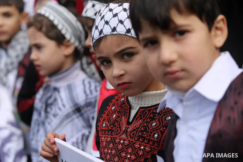 Palestinian children hold poster of teenager Ahed Tamimi, 16-year-old who held in Israeli jails during a protest to show solidarity with her, in front of Red cross office, in Gaza City January 29, 2018. Photo by Ashraf A...