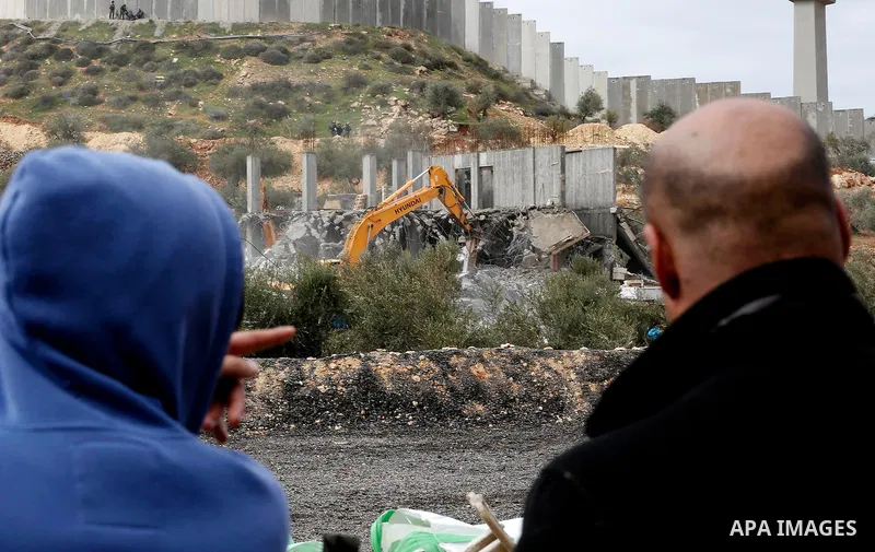 Israeli machineries demolish two under-construction Palestinian residential buildings in the West Bank town of Biet Jala, near Bethlehem January 29, 2018. Photo by Wisam Hashlamoun