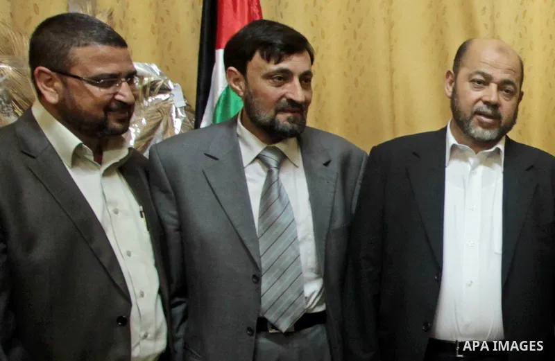 (FILES) This file photo taken on Febrayer 6, 2012 shows Hamas senior leader Imad al-Alami is welcomed by Hamas movement leaders and others after his arrival to Gaza Strip, in Gaza city. Al-Alami who died Tuesday, January...