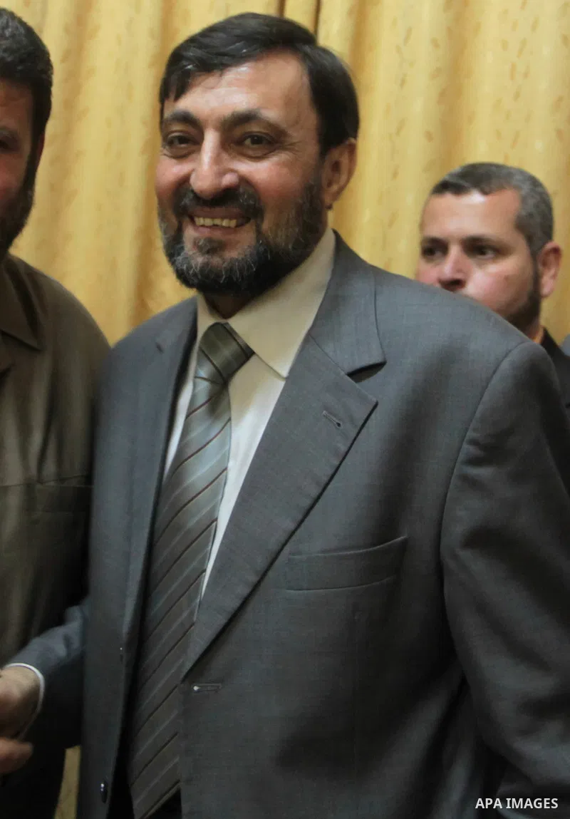 (FILES) This file photo taken on June 18, 2015 shows Hamas senior leader Imad al-Alami reacts after his arrival to Gaza Strip, in Gaza city. Al-Alami who died Tuesday, January 30, 2018 of his injuries while inspecting hi...