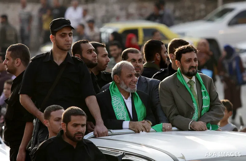 (FILES) This file photo taken on November 14, 2013 shows Hamas senior leader Imad al-Alami takes part in an anti-Israel parade as part of the celebrations marking the first anniversary of an Israeli army operation in Gaz...