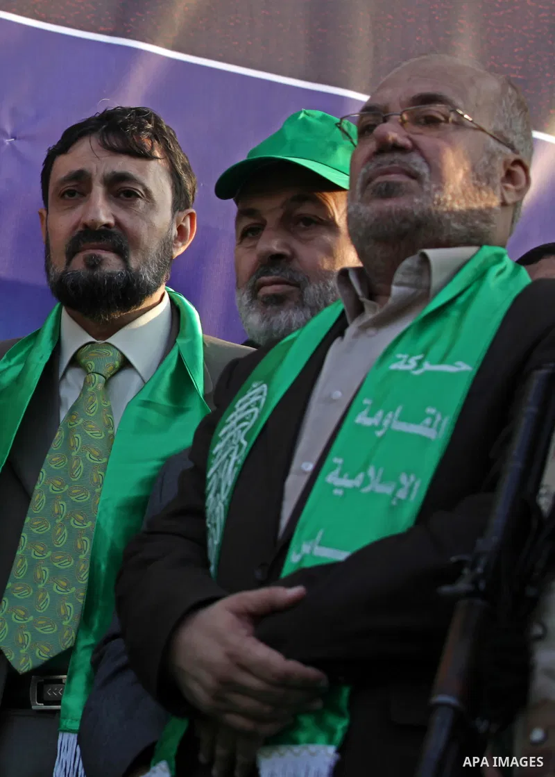 (FILES) This file photo taken on November 14, 2013 shows Hamas senior leader Imad al-Alami takes part in an anti-Israel parade as part of the celebrations marking the first anniversary of an Israeli army operation in Gaz...