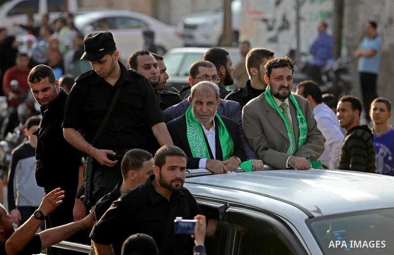 (FILES) This file photo taken on November 14, 2013 shows Hamas senior leader Imad al-Alami takes part in an anti-Israel parade as part of the celebrations marking the first anniversary of an Israeli army operation in Gaz...