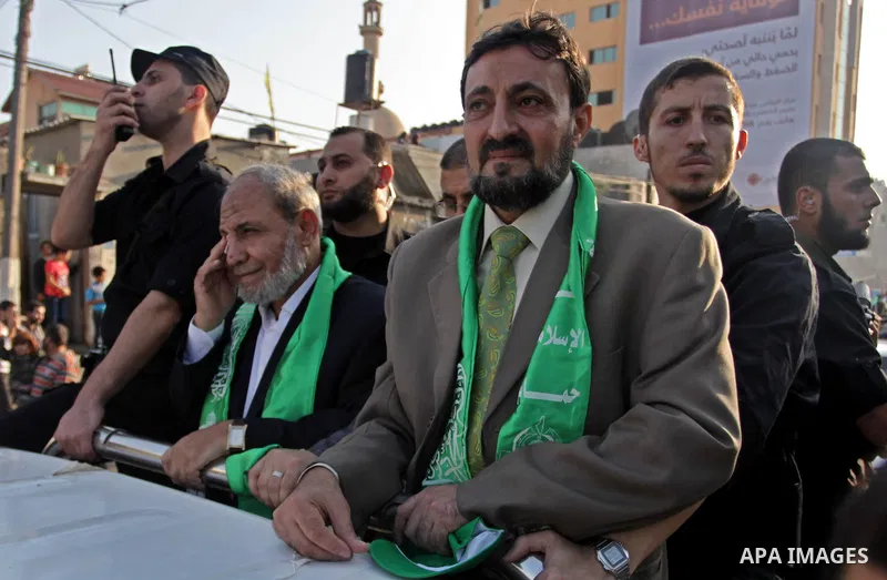 (FILES) This file photo taken on November 14, 2013 shows Hamas senior leader Imad al-Alami takes part in an anti-Israel parade as part of the celebrations marking the first anniversary of an Israeli army operation in Gaz...