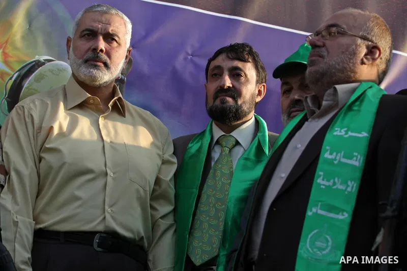 (FILES) This file photo taken on November 14, 2013 shows Hamas senior leader Imad al-Alami takes part in an anti-Israel parade as part of the celebrations marking the first anniversary of an Israeli army operation in Gaz...