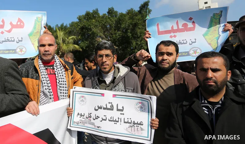 Palestinian members of National and Islamic forces take part in a protest against US President Donald Trump's decision to recognise Jerusalem as the capital of Israel in Gaza city on January 30, 2018. Photo by Ashraf Amr...