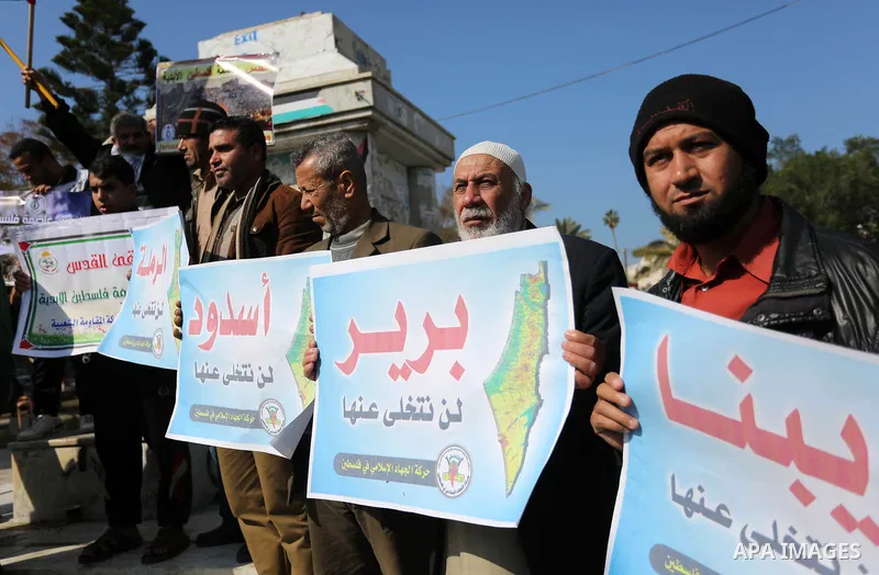 Palestinian members of National and Islamic forces take part in a protest against US President Donald Trump's decision to recognise Jerusalem as the capital of Israel in Gaza city on January 30, 2018. Photo by Ashraf Amr...