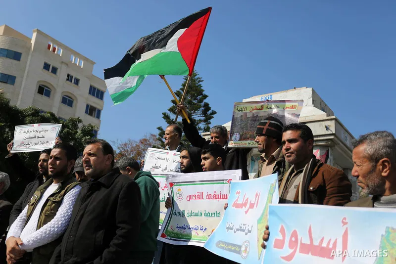 Palestinian members of National and Islamic forces take part in a protest against US President Donald Trump's decision to recognise Jerusalem as the capital of Israel in Gaza city on January 30, 2018. Photo by Ashraf Amr...