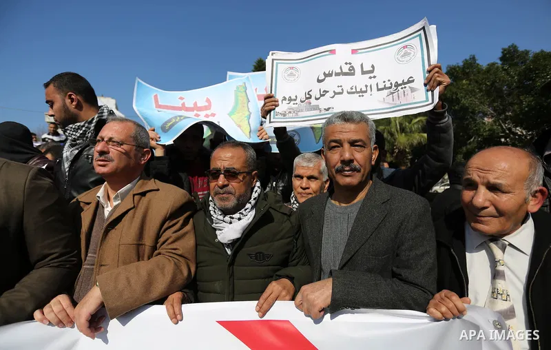 Palestinian members of National and Islamic forces take part in a protest against US President Donald Trump's decision to recognise Jerusalem as the capital of Israel in Gaza city on January 30, 2018. Photo by Ashraf Amr...
