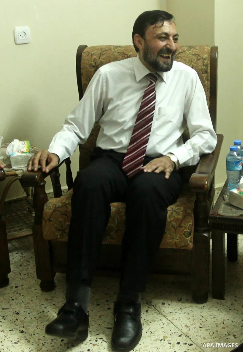 (FILES) This file photo taken on July 18, 2015 shows Hamas senior leader Imad al-Alami sits at his office in Gaza city. Al-Alami who died Tuesday, January 30, 2018 of his injuries while inspecting his personal weapon in...