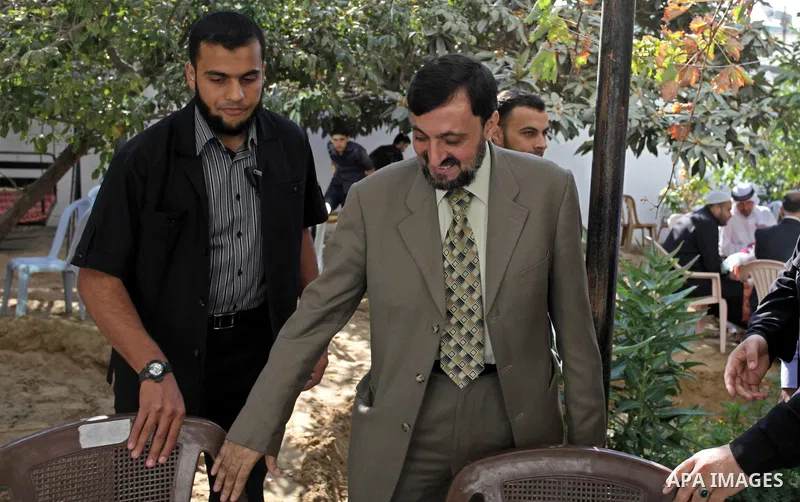 (FILES) This file photo taken on November 15, 2013 shows Hamas senior leader Imad al-Alami reacts during a meeting with Hamas leaders in Gaza city. Al-Alami who died Tuesday, January 30, 2018 of his injuries while inspec...