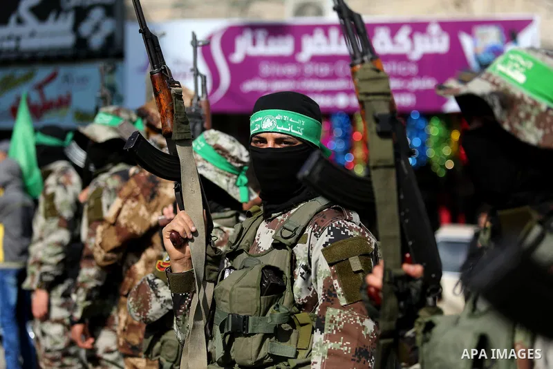 Palestinian militants from the Ezzedine al-Qassam Brigades, the armed wing of the Hamas movement attend the funeral of Hamas senior leader Imad al-Alami in Gaza City on January 30, 2018. A senior Hamas official has died...