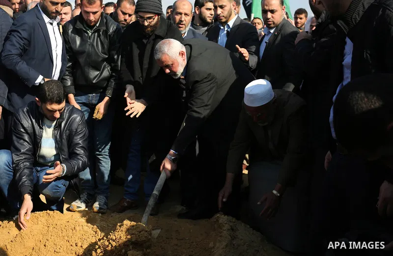Hamas Chief Ismail Haniyeh participates in the burial of Hamas senior leader Imad al-Alami at a cemetery in Gaza City on January 30, 2018. A senior Hamas official has died in Gaza three weeks after shooting himself in th...