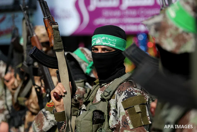 Palestinian militants from the Ezzedine al-Qassam Brigades, the armed wing of the Hamas movement attend the funeral of Hamas senior leader Imad al-Alami in Gaza City on January 30, 2018. A senior Hamas official has died...