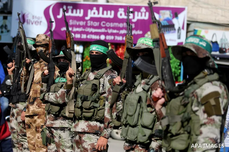 Palestinian militants from the Ezzedine al-Qassam Brigades, the armed wing of the Hamas movement attend the funeral of Hamas senior leader Imad al-Alami in Gaza City on January 30, 2018. A senior Hamas official has died...