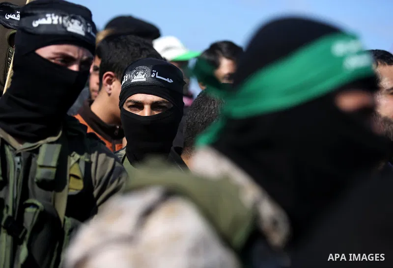 Palestinian militants from the Ezzedine al-Qassam Brigades, the armed wing of the Hamas movement attend the funeral of Hamas senior leader Imad al-Alami in Gaza City on January 30, 2018. A senior Hamas official has died...