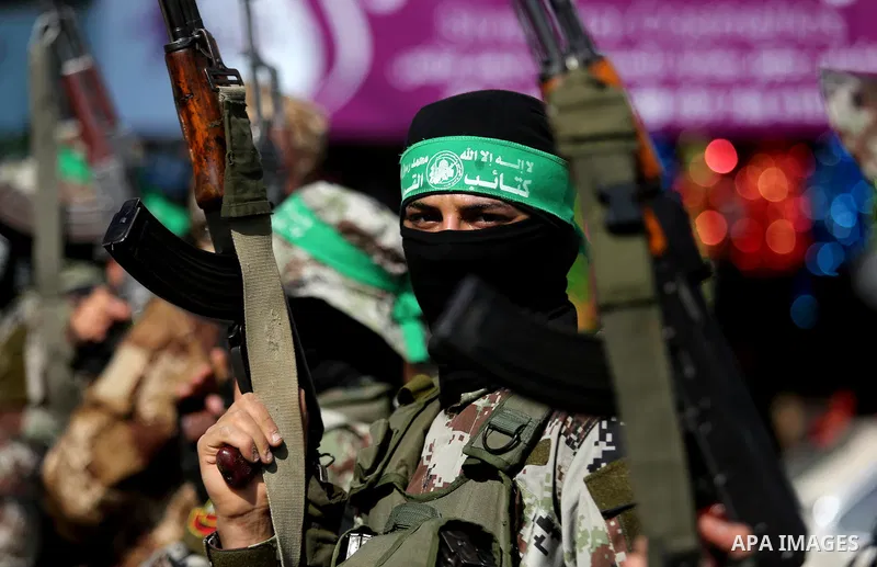 Palestinian militants from the Ezzedine al-Qassam Brigades, the armed wing of the Hamas movement attend the funeral of Hamas senior leader Imad al-Alami in Gaza City on January 30, 2018. A senior Hamas official has died...