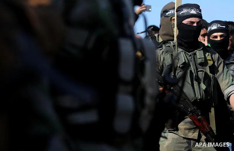 Palestinian militants from the Ezzedine al-Qassam Brigades, the armed wing of the Hamas movement attend the funeral of Hamas senior leader Imad al-Alami in Gaza City on January 30, 2018. A senior Hamas official has died...