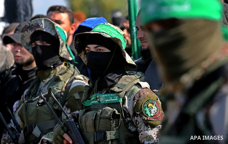 Palestinian militants from the Ezzedine al-Qassam Brigades, the armed wing of the Hamas movement attend the funeral of Hamas senior leader Imad al-Alami in Gaza City on January 30, 2018. A senior Hamas official has died...