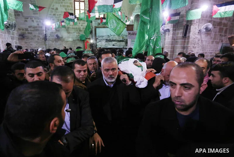Hamas Chief Ismail Haniyeh carries the body of Hamas senior official Imad al-Alami during his funeral at the al-Omari mosque in Gaza City on January 30, 2018. A senior Hamas official has died in Gaza three weeks after sh...