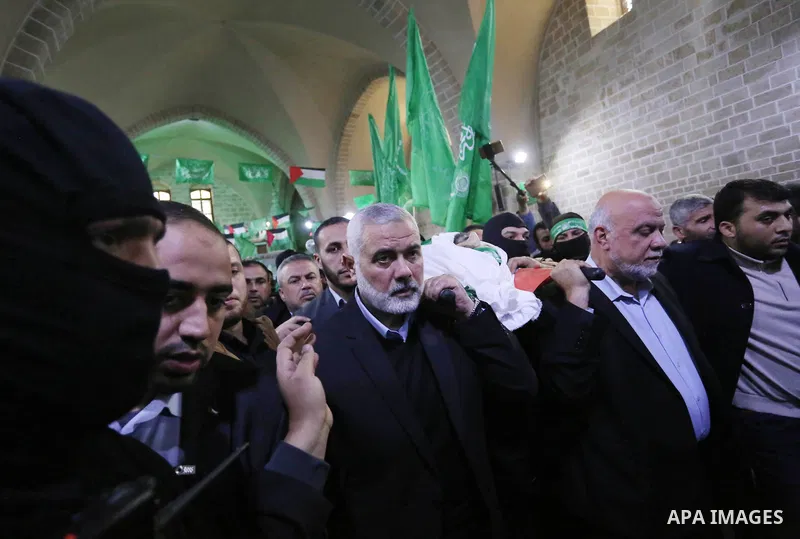 Hamas Chief Ismail Haniyeh carries the body of Hamas senior official Imad al-Alami during his funeral at the al-Omari mosque in Gaza City on January 30, 2018. A senior Hamas official has died in Gaza three weeks after sh...