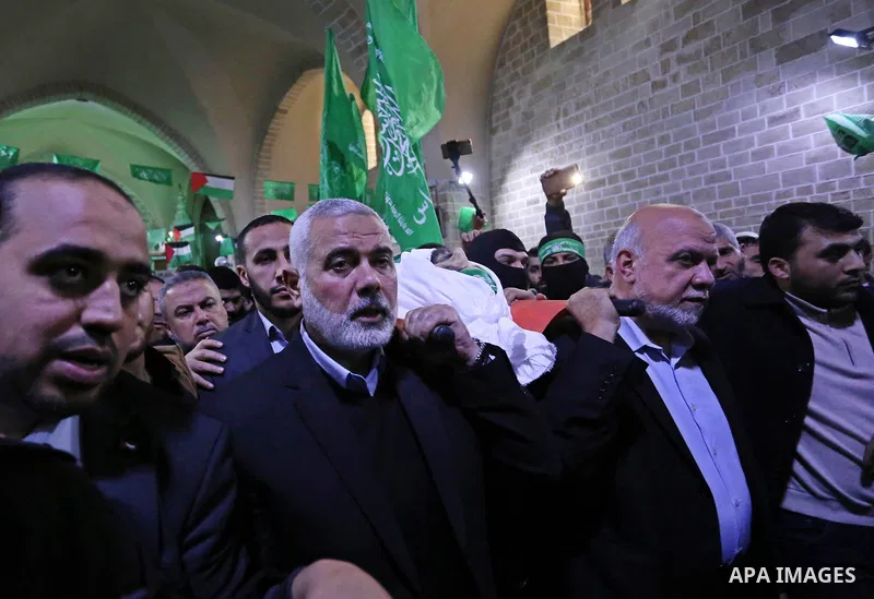 Hamas Chief Ismail Haniyeh carries the body of Hamas senior official Imad al-Alami during his funeral at the al-Omari mosque in Gaza City on January 30, 2018. A senior Hamas official has died in Gaza three weeks after sh...