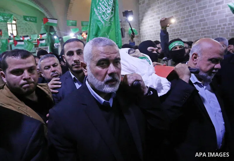 Hamas Chief Ismail Haniyeh carries the body of Hamas senior official Imad al-Alami during his funeral at the al-Omari mosque in Gaza City on January 30, 2018. A senior Hamas official has died in Gaza three weeks after sh...