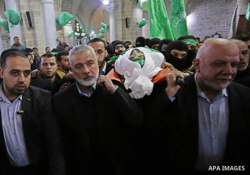 Hamas Chief Ismail Haniyeh carries the body of Hamas senior official Imad al-Alami during his funeral at the al-Omari mosque in Gaza City on January 30, 2018. A senior Hamas official has died in Gaza three weeks after sh...