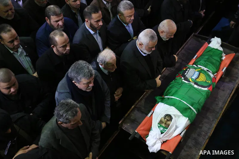 Palestinian mourners pray over the body of Hamas senior leader Imad al-Alami during his funeral at the al-Omari mosque in Gaza City on January 30, 2018. A senior Hamas official has died in Gaza three weeks after shooting...
