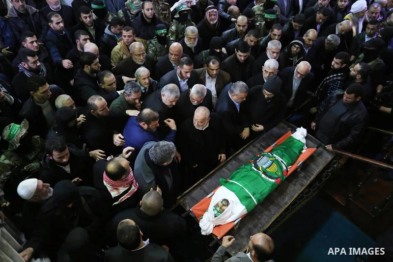 Palestinians mourn over the body of Hamas senior leader Imad al-Alami during his funeral at the al-Omari mosque in Gaza City on January 30, 2018. A senior Hamas official has died in Gaza three weeks after shooting himsel...